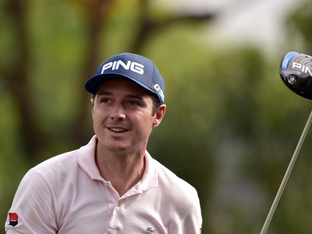 Julien Quesne of France tees off during the second round of the Volvo China Open golf tournament in Shanghai on April 24, 2015
