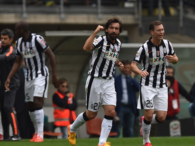 Andrea Pirlo of Juventus FC celebrates the opening goal during the Serie A match between Torino FC and Juventus FC at Stadio Olimpico di Torino on April 26, 2015