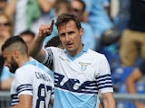Miroslav Klose of SS Lazio celebrates after scoring the opening goal during the Serie A match between SS Lazio and AC Chievo Verona at Stadio Olimpico on April 26, 2015
