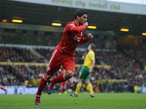 Liverpool's Uruguayan striker Luis Suarez celebrates scoring his first goal during the English Premier League football match between Norwich City and Liverpool at Carrow Road stadium in Norwich, England on April 28, 2012