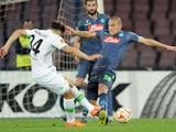 Napoli's player Gokhan Inler vies with VfL Wolfsburg player Ricardo Rodriguez during the UEFA Europa League quarter-final second leg match between SSC Napoli and VfL Wolfsburg on April 23, 2015