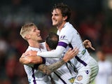 Andrew Keogh of the Glory celebrates with team mates Joshua Risdon and Richard Garcia after scoring a goal during the round 27 A-League match between the Western Sydney Wanderers and the Perth Glory at Pirtek Stadium on April 25, 2015
