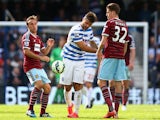 Charlie Austin of QPR throws the ball down in frustration during the Barclays Premier League match between Queens Park Rangers and West Ham United at Loftus Road on April 25, 2015