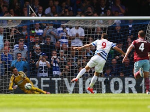 Adrian of West Ham saves a penalty from Charlie Austin of QPR during the Barclays Premier League match between Queens Park Rangers and West Ham United at Loftus Road on April 25, 2015