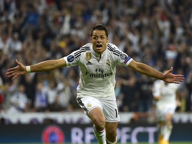Real Madrid's Mexican forward Javier Hernandez celebrates after scoring a goal during the UEFA Champions League quarter-finals second leg football match Real Madrid CF vs Club Atletico de Madrid at the Santiago Bernabeu stadium in Madrid on April 22, 2015