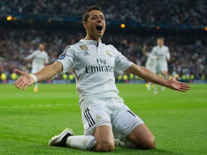 Javier Hernandez of Real Madrid CF celebrates as he scores their first goal during the UEFA Champions League quarter-final second leg match between Real Madrid CF and Club Atletico de Madrid at Bernabeu on April 22, 2015