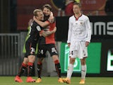 Rennes' Bosnian midfielder Sanjin Prcic celebrates with Rennes' Polish forward Kamil Grosicki after scoring a goal during the French L1 football match between Rennes and Nice on April 25, 2015