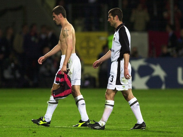 Despair for Roy Keane and Denis Irwin of Manchester United after the UEFA Champions League semi-final second leg match between Bayer Leverkusen and Manchester United played at the BayArena, in Leverkusen, Germany on April 30, 2002