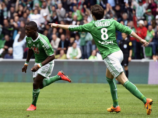 Saint-Etienne's Ivorian forward Max-Alain Gradel is congratuled by his teammate St Etienne's French midfielder Benjamin Corgnet after he scored during the French L1 football match AS Saint-Etienne against Montpellier HSC, on April 26, 2015 