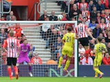 Southampton's Italian striker Graziano Pelle heads the ball to score his second goal past Tottenham Hotspur's French goalkeeper Hugo Lloris during the English Premier League football match between Southampton and Tottenham Hotspur at St Mary's Stadium in 