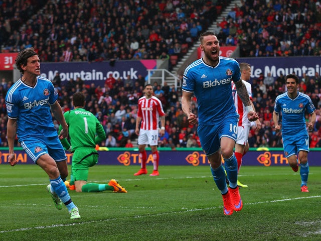 Connor Wickham of Sunderland celebrates scoring the opening goal with Billy Jones of Sunderland during the Barclays Premier League match between Stoke City and Sunderland at Britannia Stadium on April 25, 2015