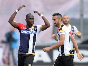 Emmanuel Agyemang Badu of Udinese Calcio celebrates with his teams mate Giampiero Pinzi after scoring his teams second goal during the Serie A match between Udinese Calcio and AC Milan at Stadio Friuli on April 25, 2015