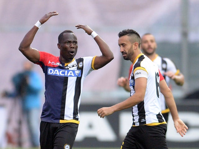 Emmanuel Agyemang Badu of Udinese Calcio celebrates with his teams mate Giampiero Pinzi after scoring his teams second goal during the Serie A match between Udinese Calcio and AC Milan at Stadio Friuli on April 25, 2015