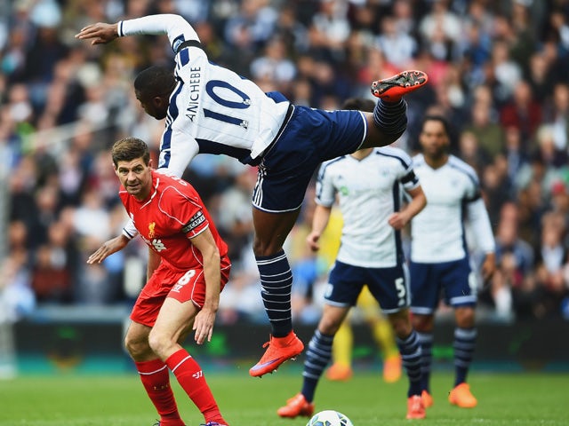 Victor Anichebe of West Brom climbs above Steven Gerrard of Liverpool during the Barclays Premier League match between West Bromwich Albion and Liverpool at The Hawthorns on April 25, 2015