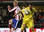 Atletico Madrid's French forward Antoine Griezmann (L) vies with Villarreal's defender Victor Ruiz during the Spanish league football match Villarreal CF vs Club Atletico de Madrid at El Madrigal stadium in Villareal on April 29, 2015