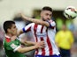 Atletico Madrid's Brazilian defender Guilherme Siqueira vies with Athletic Bilbao's defender Unai Bustinza during the Spanish league football match Club Atletico de Madrid vs Athletic Club Bilbao at the Vicente Calderon stadium in Madrid on May 2, 2015