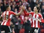 Jota of Brentford celebrates scoring his goal with Andre Gray during the Sky Bet Championship match between Brentford and Wigan Athletic at Griffin Park on May 2, 2015