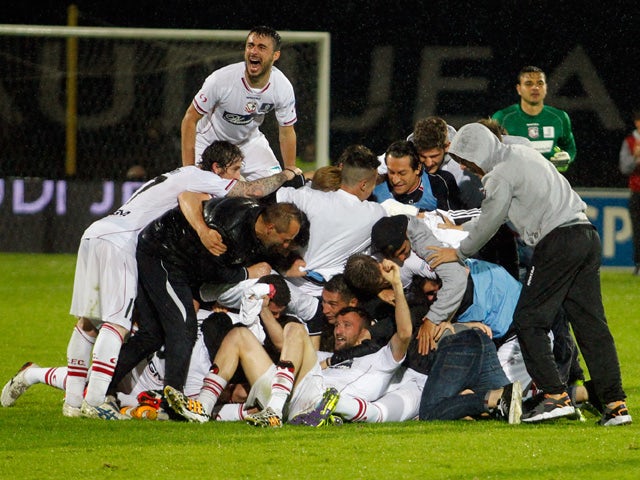 Player of Carpi celebrate after being to promoted to Serie A during the Serie B match between Carpi FC and FC Bari at Stadio Sandro Cabassi on April 28, 2015