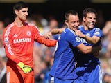 Chelsea players Thibaut Courtois, John Terry and Cesar Azpilicueta celebrate after the Blues secured the Premier League title on May 3, 2015
