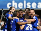Chelsea players celebrate after the English Premier League football match between Chelsea and Crystal Palace at Stamford Bridge in London on May 3, 2015