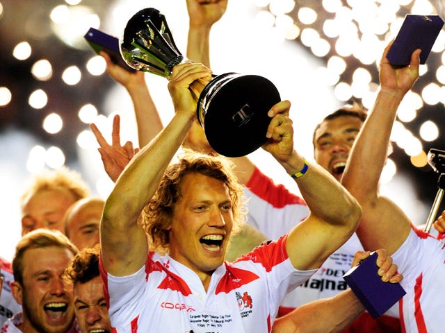 Captain Billy Twelvetrees of Gloucester lifts the trophy following his team's victory during the European Rugby Challenge Cup Final match between Edinburgh and Gloucester at the Twickenham Stoop on May 1, 2015