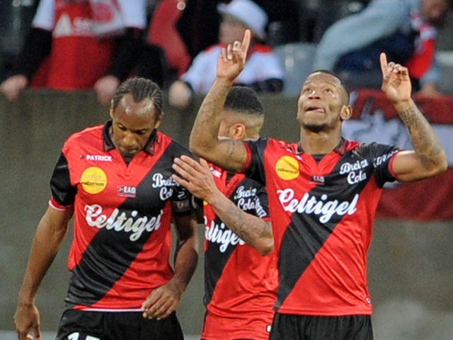 Guingamp's French midfielder Claudio Beauvue jubilates after scoring during the French L1 football match Guingamp versus Reims on May 2, 2015