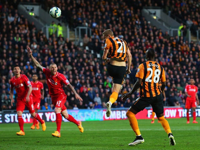 Michael Dawson of Hull City scores their first goal during the Barclays Premier League match between Hull City and Liverpool at KC Stadium on April 28, 2015