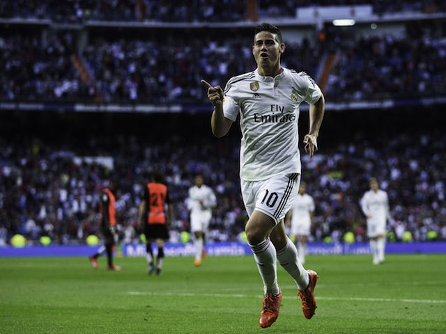 James Rodriguez of Real Madrid CF celebrates scoring their opening goal during the La Liga match between Real Madrid CF and UD Almeria at Estadio Santiago Bernabeu on April 29, 2015