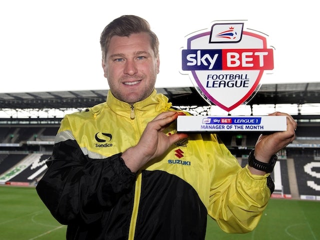 MK Dons manager Karl Robinson with his League One Manager of the Month award for April on April 30, 2015