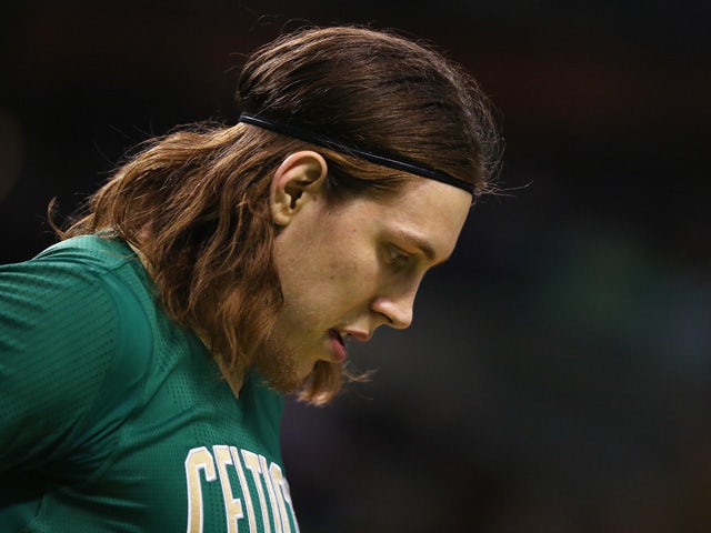 Kelly Olynyk #41 of the Boston Celtics looks on at TD Garden on March 16, 2015