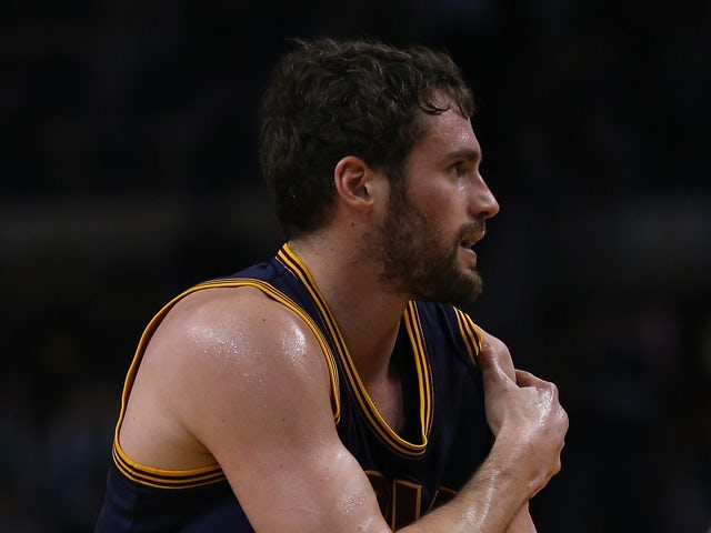 Kevin Love #0 of the Cleveland Cavaliers reacts after an injury against the Boston Celtics in the first quarter in Game Four during the first round of the 2015 NBA Playoffs on April 26, 2015