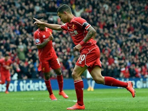 Liverpool's Brazilian midfielder Philippe Coutinho celebrates scoring during the English Premier League football match between Liverpool and Queens Park Rangers at the Anfield stadium in Liverpool, northwest England, on May 2, 2015