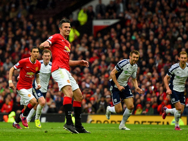 Robin van Persie of Manchester United reacts after taking a penalty which is saved by Boaz Myhill of West Brom during the Barclays Premier League match between Manchester United and West Bromwich Albion at Old Trafford on May 2, 2015 