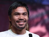 WBO welterweight champion Manny Pacquiao smiles during a fan rally at the Mandalay Bay Convention Center on April 28, 2015