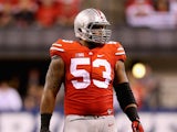 Defensive lineman Michael Bennett wears #53 to honor late teammate Kosta Karageorge of the Ohio State Buckeyes during the Big Ten Championship against the Wisconsin Badgers at Lucas Oil Stadium on December 6, 2014