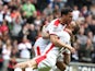 Carl Baker of MK Dons is congratulated by team mate Samir Carruthers after scoring his sides 1st goal during the Sky Bet League One match between MK Dons and Yeovil Town at Stadium mk on May 3, 2015 