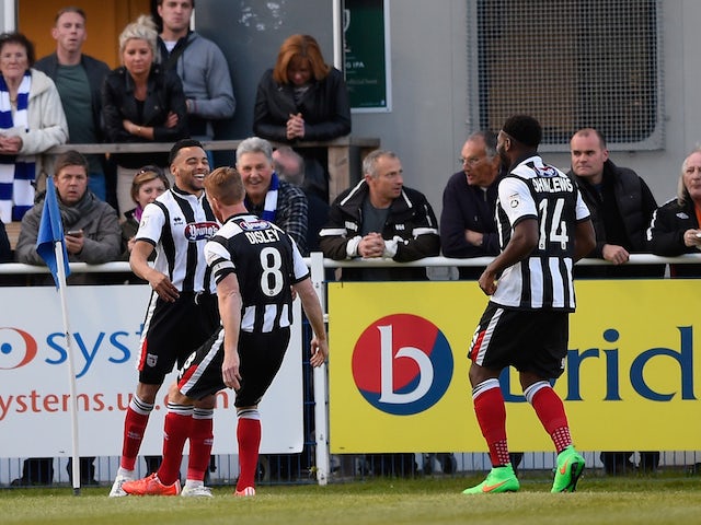 Nathan Arnold of Grimsby (L) celebrates with team mates after scoring during the Vanarama Football Conference League play off 1st leg match between Eastleigh FC and Grimsby Town at Silverlake Stadium on April 30, 2015
