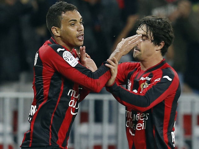 Nice's Brazilian midfielder Carlos Eduardo celebrates with Nice's French defender Gregoire Puel after scoring a goal during the French L1 football match between Nice and Caen on May 2, 2015