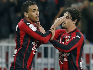 Nice's Brazilian midfielder Carlos Eduardo celebrates with Nice's French defender Gregoire Puel after scoring a goal during the French L1 football match between Nice and Caen on May 2, 2015