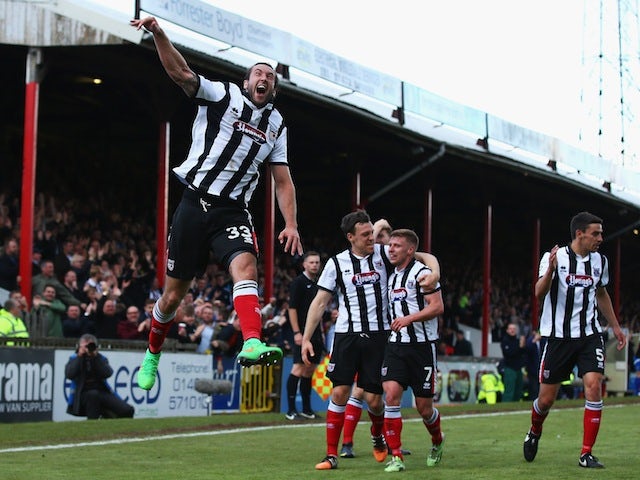 Ollie Palmer of Grimsby Town celebrates his second goal during the Vanarama Football Conference League match between Grimsby Town and Eastleigh FC at Blundell Park on May 3, 2015