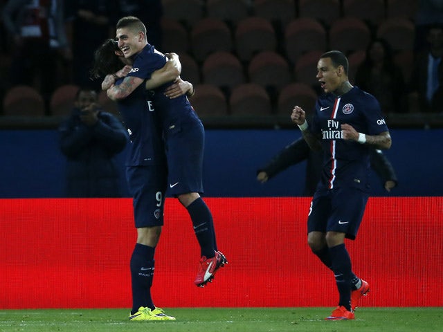 Paris Saint-Germain's Italian midfielder Marco Verratti celebrates with Dutch defender Gregory van der Wiel and Brazilian defender Maxwell after scoring a goal during the French L1 football match between Paris Saint-Germain (PSG) and Metz at the Parc des 