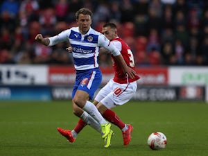 Simon Cox of Reading controls the ball from Jack Hunt of Rotherham during the Sky Bet Championship match between Rotherham United and Reading at The New York Stadium on April 28, 2015