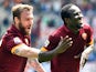 Roma's Ivorian midfielder Seydou Doumbia celebrates with Roma's forward Daniele De Rossi after scoring a goal during the Italian Serie A football match between AS Roma and Genoa on May 3, 2015