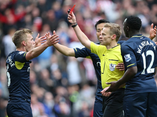 Southampton's English midfielder James Ward-Prowse (L) is given a red card during the English Premier League football match between Sunderland and Southampton at the Stadium of Light in Sunderland, northeast England, on May 2, 2015