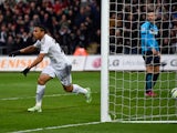 Jefferson Montero of Swansea City celebrates scoring his team's first goal during the Barclays Premier League match between Swansea City and Stoke City at Liberty Stadium on May 2, 2015