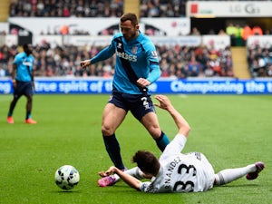 Phillip Bardsley of Stoke City and Federico Fernandez of Swansea City compete for the ball during the Barclays Premier League match between Swansea City and Stoke City at Liberty Stadium on May 2, 2015