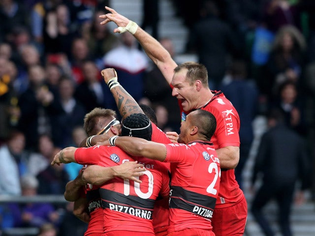 Drew Mitchell of Toulon is congratulated by teammates after scoring his team's second try during the European Rugby Champions Cup Final match between ASM Clermont Auvergne and RC Toulon at Twickenham Stadium on May 2, 2015
