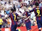 Barcelona's forward Pedro Rodriguez celebrates with teammate Barcelona's Argentinian forward Lionel Messi (C) after scoring during the Spanish league football match FC Barcelona vs Real Sociedad de Futbol at the Camp Nou stadium in Barcelona on May 9, 201