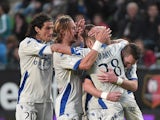 Bastia's French striker Gael Danic (jersey #28) celebrates with teammates after scoring during the French L1 football match Rennes against Bastia on May 9, 2015