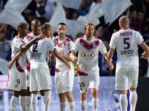 Bordeaux's players celebrate after scoring a goal during the French L1 football match between Bordeaux and Nantes on may 9, 2015